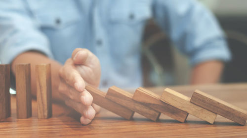 Close-up of man working on table