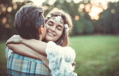 Happy couple embracing outdoors