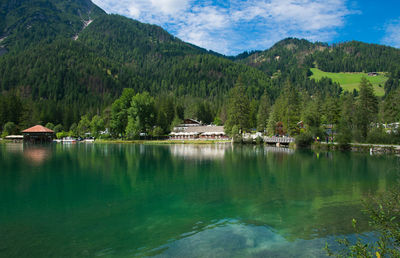 Scenic view of lake and mountains against sky