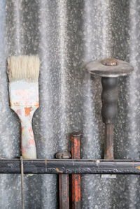 Close-up of metal pipe on wet wall