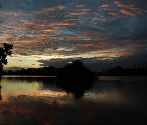 Scenic view of lake against sky during sunset