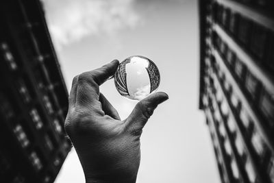 Close-up of hand holding ball