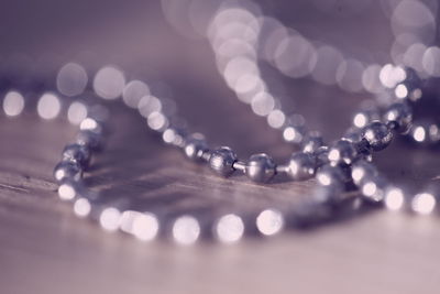 Close-up of necklace on table