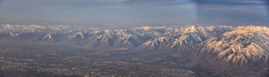 Scenic view of land against sky during winter