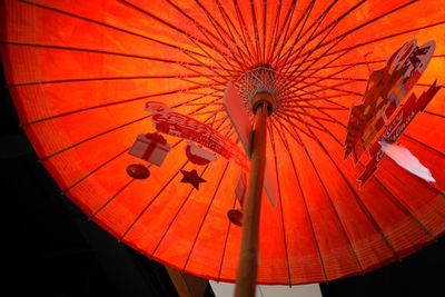 Low angle view of illuminated lanterns hanging from ceiling