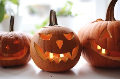 Close-up of jack o lanterns on table during halloween