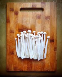 Close-up high angle view of mushrooms on chopping board