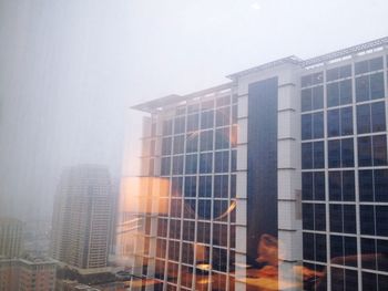 Buildings in city against sky