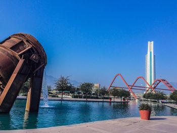 Swimming pool against clear blue sky