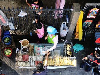 High angle view of man buying street food
