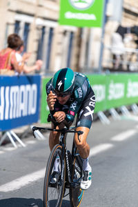 Man riding bicycle on road