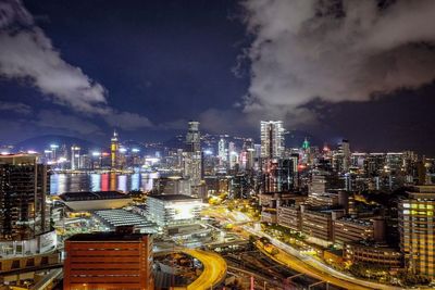 High angle view of illuminated buildings against sky at night