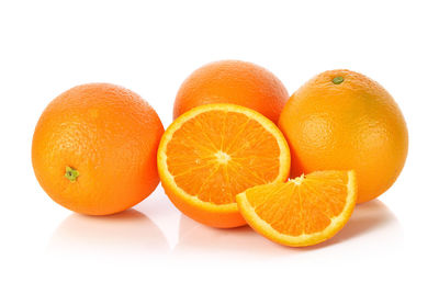 Close-up of orange fruit against white background