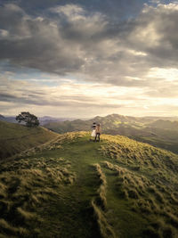 People hiking at te mata peak in north island of new zealand