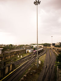 Train on railroad tracks against sky