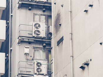 Low angle view of electric lamp on building