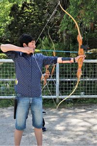 Boy learning archery