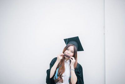 Portrait of young woman in hat