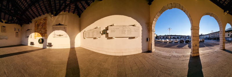 Immersive panoramic view of historical lobby at sunset light