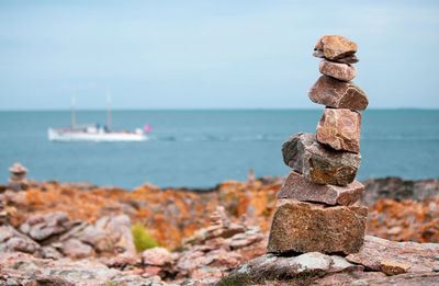 Rocks on sea against sky