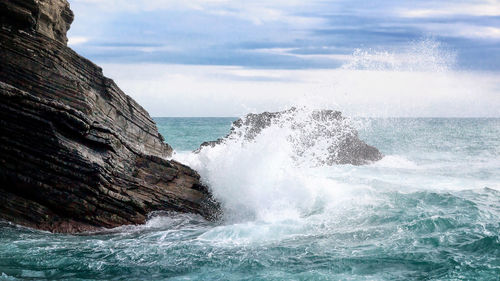 View of waves in sea against sky