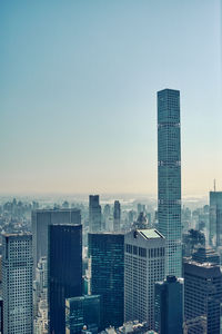 Modern buildings in city against clear sky