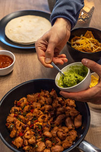 Midsection of man preparing food