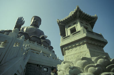 Low angle view of statue against sky