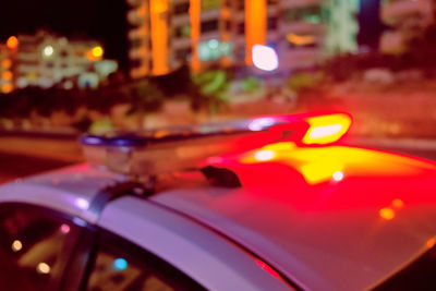 Close-up of illuminated lights in city at night