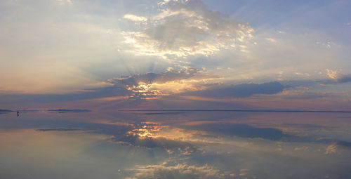 Panoramic view of lake at bonneville salt flats against sky during sunset
