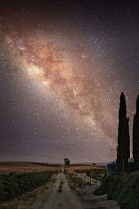 Scenic view of land against sky at night