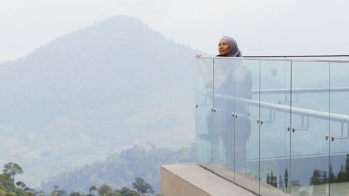 Man on mountain against sky