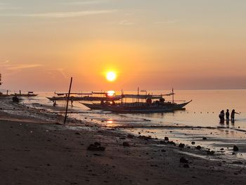 Scenic view of beach against sky during sunset