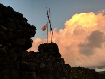 Low angle view of rock formations against sky during sunset