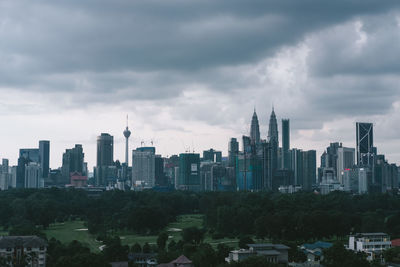 Modern buildings in city against sky