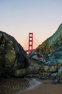 Bridge over river against clear sky