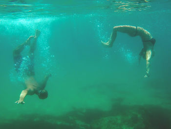 People swimming in sea