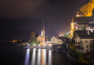 Illuminated buildings in city at night