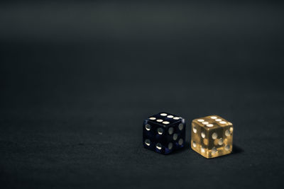 Close-up of vintage car on table against black background