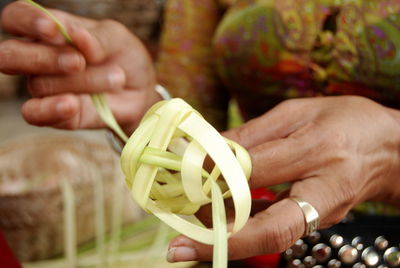 Close-up of hand holding painting