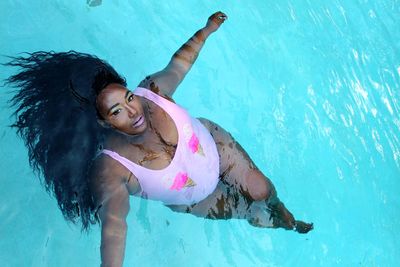 High angle view of woman swimming in pool