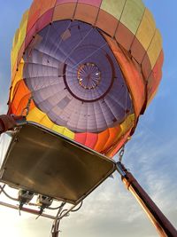 Low angle view of hot air balloons against sky