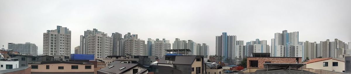 Modern buildings in city against sky