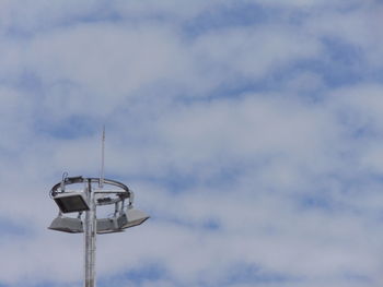 Low angle view of communications tower against sky