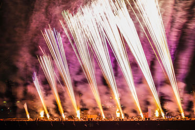 Firework display at night