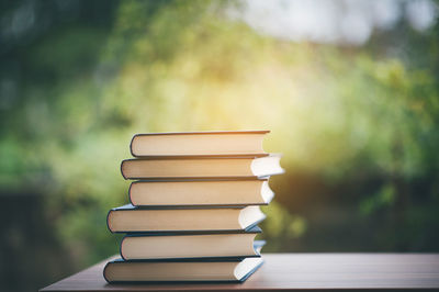 Stack of books on table at home