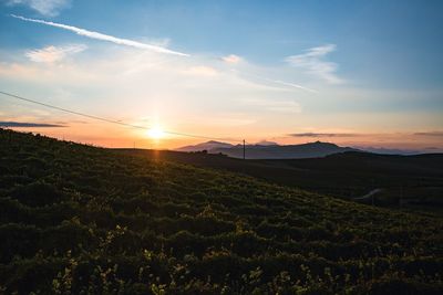 Scenic view of landscape against sky during sunset