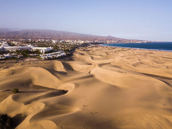 Scenic view of beach against clear sky