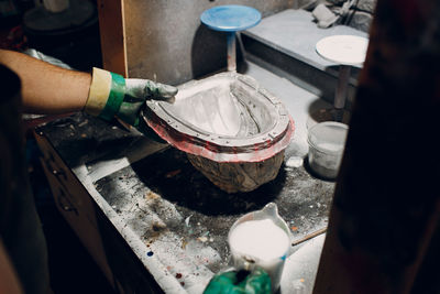 Cropped hand of person welding metal