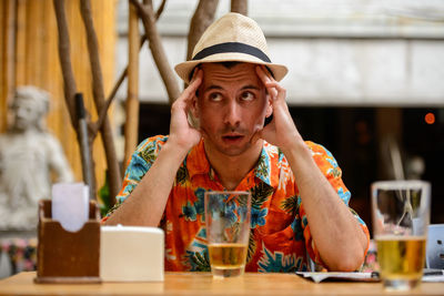 Depressed man sitting in cafe